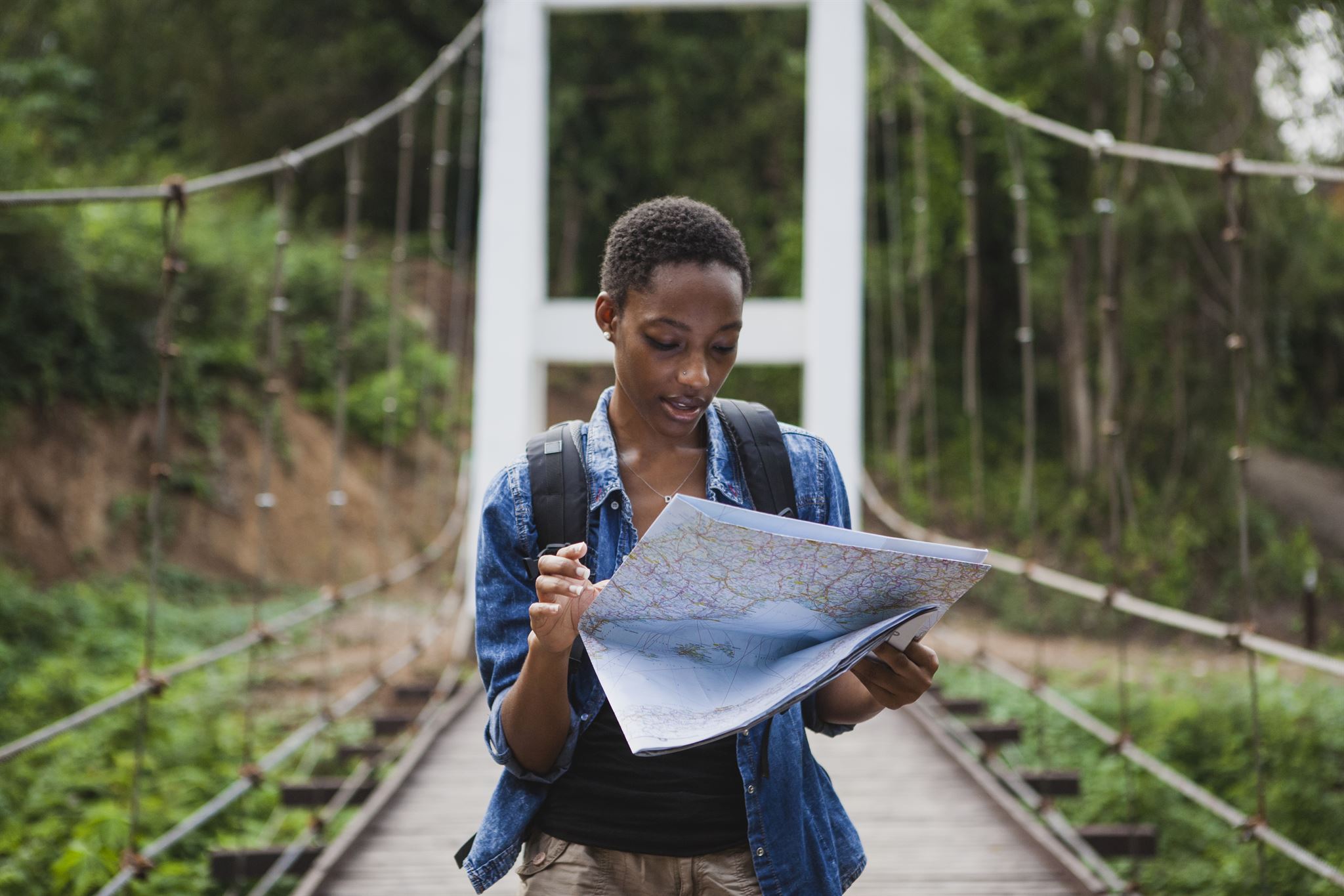 Person-on-bridge-navigating-map